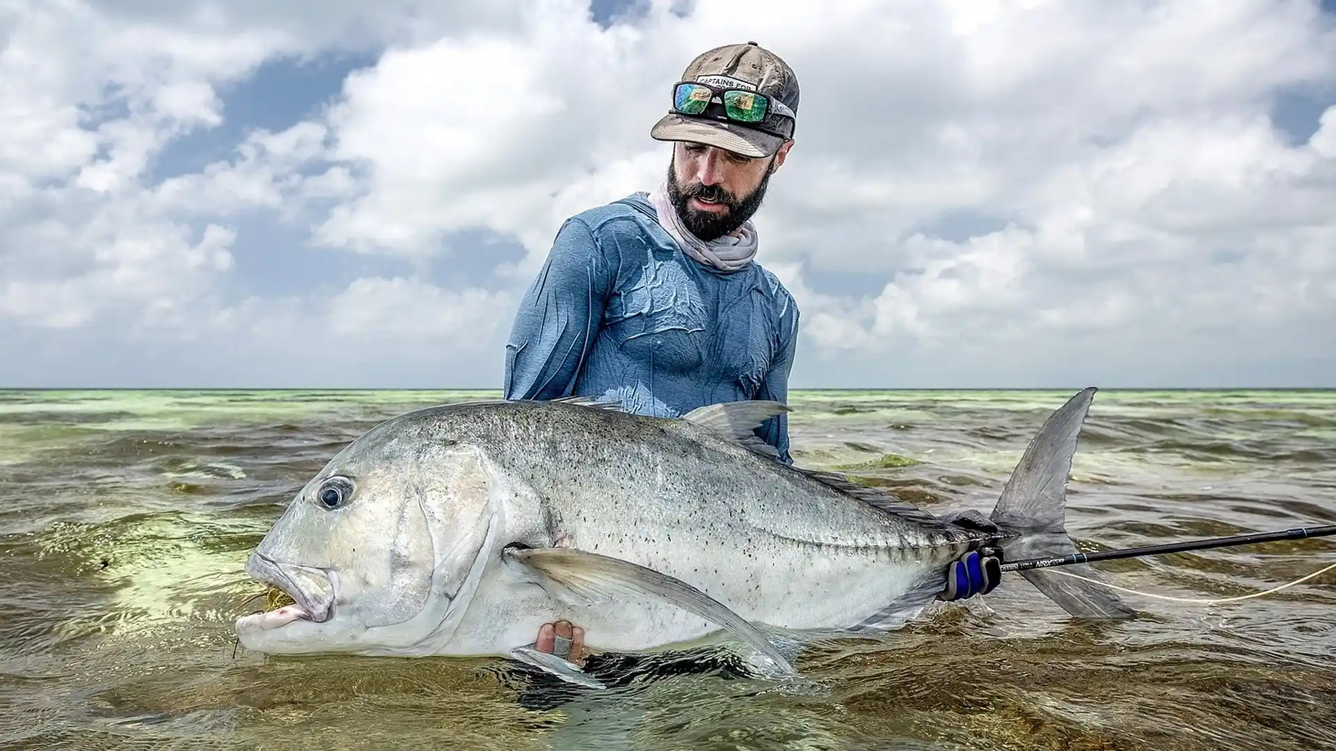 Alphonse GT Alphonse Island angler with a large giant trevally while fly fishing.